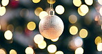 Christmas ball, golden bokeh and shiny decoration with sparkle for festive holidays, celebration and holiday season in home. Party decor, illustration and xmas confetti with winter lights and shine