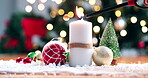 Light, flame and candle for Christmas with decoration in home with tree, ornament and festive table. Holiday, event and lighter burning to celebrate Christian, Advent or setting for winter party