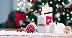 Advent, flame and light candles for Christmas with decoration in home with tree, ornament or festive table. Winter, event and lighter burning to celebrate Christian, holiday or setting for party