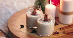 Christmas morning, eggnog and cookies for holiday celebration, cold day and breakfast. Hot cocoa, beverage and celebrating with candles, food and festive season tradition with biscuits and cozy