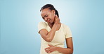 Neck pain, injury and woman in studio with stress, tired joints and arthritis risk on blue background. Frustrated african model massage bruise for first aid, health emergency and fatigue of muscle 