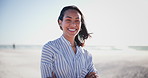 Beach, holiday and face of happy woman in summer, vacation or relax with arms crossed in nature. Confident, person and portrait with smile, health and wellness in Brazil sunshine, outdoor or blue sky