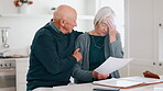 Senior couple, sad and stress for bills, debt and financial mistake, budget fail or documents in kitchen. Love, hug and support of elderly man and woman with depression for home loan or bankruptcy