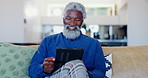 Senior man, tablet and smile on sofa, reading news app and social media post in lounge at home. Happy elderly african guy relax to scroll digital blog, online shopping or download ebook in retirement