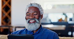 Senior man, tablet and laugh in home for reading news app, social media post or download meme in lounge. Face of elderly african guy scroll digital blog, online shopping and funny ebook in retirement