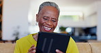 Senior woman, tablet and laugh on sofa, reading news app or funny ebook in living room. Happy elderly african lady relax to scroll digital blog, online shopping or download meme in retirement at home