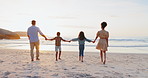 Back, holding hands and family with sunset, beach and vacation with ocean, water and support. Parents, mother and father with children, kids and ocean with adventure, seaside and holiday on a break