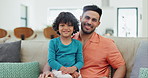 Selfie, happy and face of father and child on a sofa for bonding and relaxing together at home. Smile, love and young Indian dad taking a picture with boy kid in the living room of modern house.