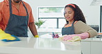 Father, daughter and cleaning kitchen with gloves, teaching hygiene and removing bacteria on counter. Housekeeping together, smile and happy to help in family home, talking and learning from parent 