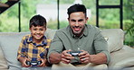 Dad, kid and play video game, smile and competition in home living room together. Tv tech, father and child on controller console, esports entertainment and happy family bonding in contest on sofa