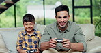 Father, kid and play video game, smile and competition in home living room together. Tv tech, dad and child on controller console, entertainment and happy family bonding, cheat and contest on sofa