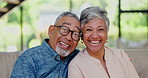 Love, face and happy senior couple on a sofa hug, laugh and relax at home together. Security, support and portrait of old people embrace in a living room with retirement freedom and communication
