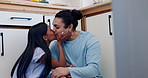 Happy couple, relax and morning kiss in kitchen for conversation or bonding on floor at home. Man and woman talking or enjoying embrace, love or compassion in care, romance or support at house