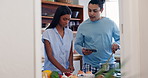 Cooking, recipe and phone of couple in a kitchen with communication and home together with food. Nutrition website, online blog and reading instruction for meal with people ready for eating lunch