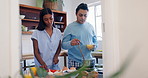 Love, cooking and couple in the kitchen with recipe on the internet for breakfast on weekend. Happy, conversation and young man and woman preparing healthy diet meal for lunch in modern apartment.