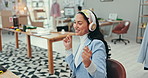 Music, dance and fashion designer woman at work in office with computer for creative planning or research. Smile, freedom and headphones with a happy small business or startup employee in a workplace