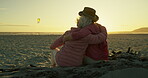 Elderly, women and hug on beach with sunset for bonding, relax and support on holiday, vacation or travel. Senior, friends and embrace by ocean or sea with sunrise, lens flare or retirement with back