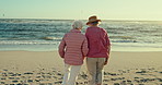 Senior women, friends and back by sea with holding hands, care and bonding with reunion at beach. Elderly lady, people and embrace with waves, ocean and freedom on vacation, walking and retirement