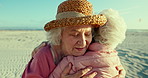 Senior women, friends and beach with hug, care or love on vacation in summer, sunshine or freedom. People, retirement and embrace for reunion by ocean, holiday or relax outdoor on adventure in Naples