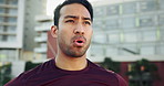 Breathing, sports and man running in city for race, competition or marathon training. Fitness, workout and young male athlete runner from Mexico on break for cardio exercise on bridge in urban town.