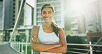 Happy woman, city and fitness professional in confidence for workout, running or outdoor training in health and wellness. Portrait of female person, runner or athlete smile for exercise in urban town