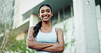 Face outdoor and woman with arms crossed, fitness and energy with a smile, confident girl and exercise. Portrait, person and runner with workout, progress and city with training, wellness or cheerful