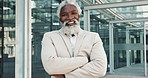 Smile, arms crossed and mature business black man in lobby of glass office for corporate employment or career. Portrait, management and confidence with happy professional CEO or executive at work