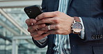 Businessman, hands and phone typing for communication, social media or outdoor networking in city. Closeup of man or employee browsing or scroll on mobile smartphone for business or research outside