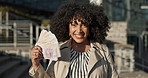 Happy business woman, money and city in financial freedom for winning, investment or salary outside. Female person or employee smile with cash, fan or profit for outdoor finance in an urban town