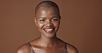 Face, beauty and smile with happy black woman in studio isolated on brown background for wellness. Portrait, skincare and aesthetic for foundation cosmetics or dermatology with a natural bald person