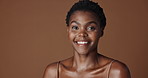 Face, beauty and aesthetic with happy black woman in studio isolated on brown background for wellness. Portrait, skincare and smile for foundation cosmetics or dermatology with a natural young person