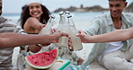 Friends, toast with fruit drinks and beach for celebration, outdoor party and new year holiday with alcohol bottle. Happy people with watermelon, soda or ginger beer cocktail for cheers and vacation