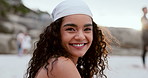 Woman, face and relaxing on beach vacation, smiling and happy in outdoors or travel to ocean for fun. Female person, portrait and laughing for humor in nature, peace and sand on holiday or getaway