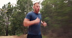 Nature, fitness and man athlete running for race, marathon or competition training for endurance. Sports, blur motion and runner with cardio exercise or workout for speed in forest, woods or field.