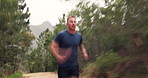 Nature, health and man athlete running for race, marathon or competition training for endurance. Sport, blur motion and male runner with cardio exercise or workout for speed in forest, woods or field