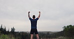 Man celebrate, success and workout in nature for running, hiking or fitness goals, achievement and yes in wellness. Back of sports person or runner with fist, power and energy for exercise in forest