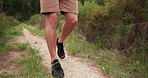 Man, legs and hiking in nature, path or adventure for travel, training and holiday with fitness in forest. Person, shoes or sneakers on ground, walking and outdoor in woods, bush and trekking journey