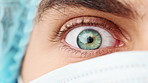 Closeup eye of surgeon. Man opening eye