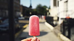 Walking, popsicle and hand of person in street eating strawberry flavor dessert for travel pov in city. Outdoor, content creator or influencer recording a video for a vlog on social media in street