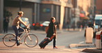 Blurred people cycling and walking around in the background of the city