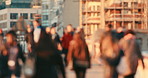 A crowd of people walking together on the street