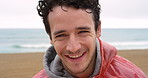 Excited young man cheerfully laughing on a cold day during his holiday