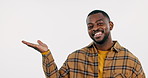 Hand for offer, face or black man in studio by discount deal or sale on menu for advertising. Smile, happy or African person pointing to show choice for mockup space promo or logo on white background