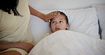 Hand, sick or fever with daughter and parent in bedroom of home together for health, recovery or rest. Family, medical or girl in bed and virus, cold or flu at apartment with illness and allergies