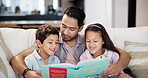 Family, reading and kids with father on sofa in living room of home together for learning or literature. Education, storytelling book or child development with man, boy and girl children in apartment