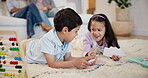 Learning, cards and children siblings on floor for alphabet lesson for language, studying or letter. School, homework or happy kids help with family on mat for teaching education, literacy or phonics