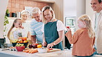 Happy, big family and cooking dinner in kitchen with vegetables, food and nutrition in home. Heathy, diet and mother meal prep salad with hungry grandparents and children eating fruit on table