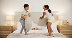 Bedroom, pillow fight and brother with sister, happiness and fun with entertainment and bonding together. Kids, boy or girl on a bed, cushions or playing with weekend break or enjoying a game at home