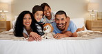 Jump, love and face of family on a bed for playing, bonding or games in at home together. Portrait, support or children embrace parents in a bedroom with security, safety or having fun in their house