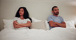 Couple, conflict and angry from fight in bedroom with toxic  marriage or thinking about divorce. Frustrated, woman and man in home with stress from drama, crisis or separation in relationship